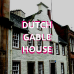 A white building with pink and white text in front of it: Dutch Gable House
