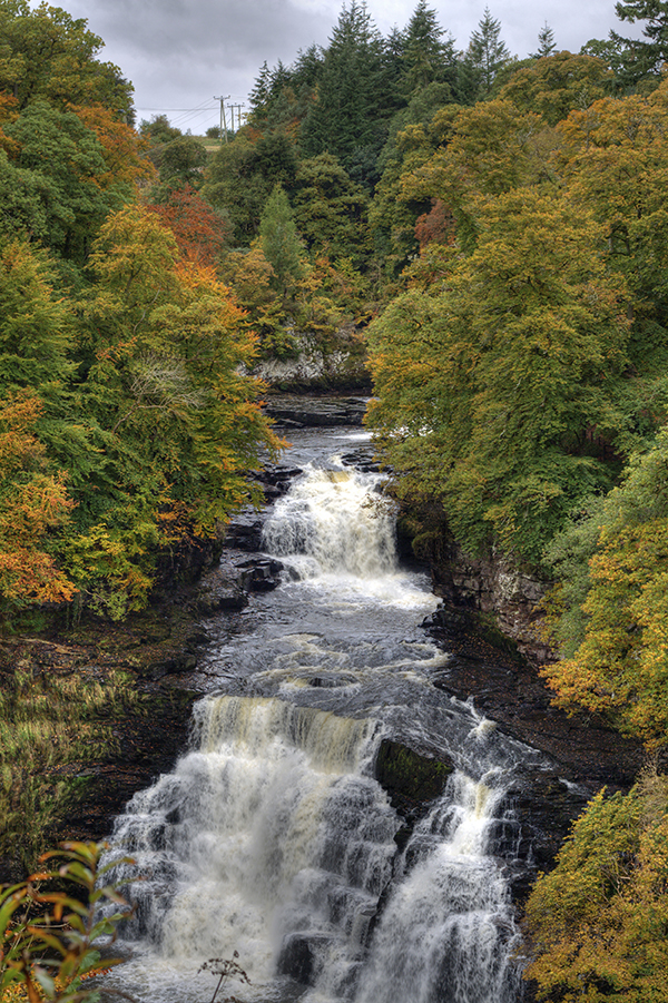 Falls of Clyde Waterfall, Scotland at Autumn.
