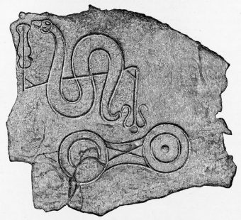 Photo of a serpent-like carving on a symbol stone.
