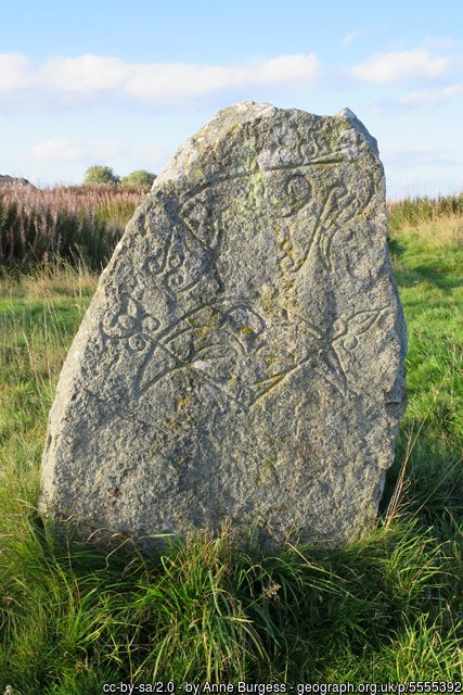 Standing stone with symbols on it