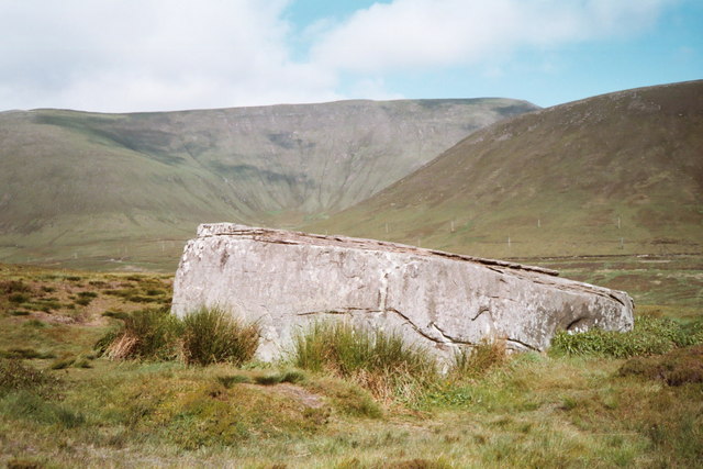 Rectangular stone among grass