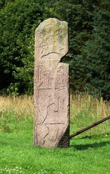 Standing stone with symbols on it