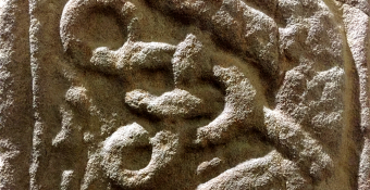 Stone carving of two serpents