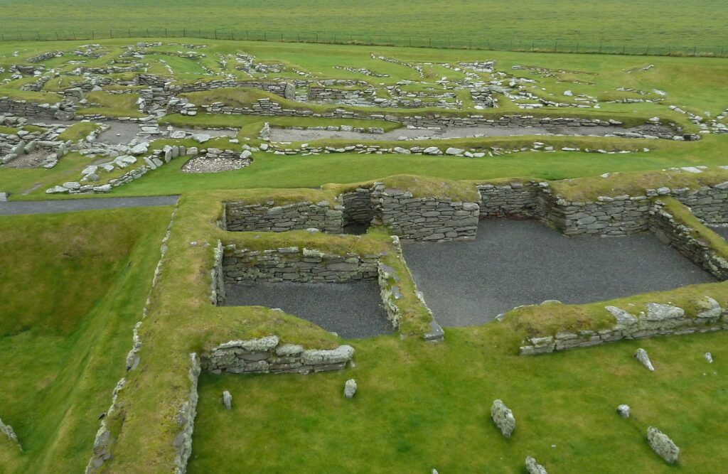 Excavated stone buildings with turf on top