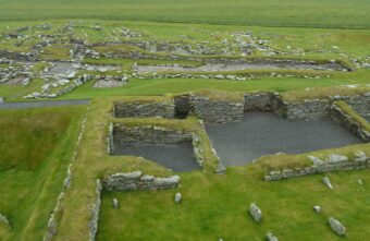 Excavated stone buildings with turf on top