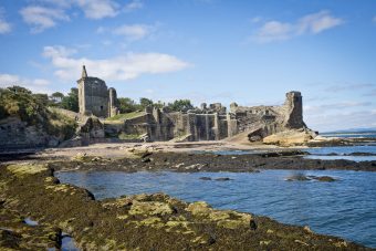 Photo of a ruined castle by the sea.