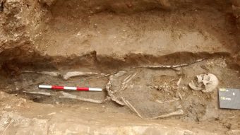 Burial in church with complete wooden staff