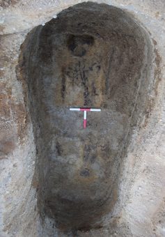 The partly preserved remains of a Pictish skeleton surrounded by the faint shadow of a coffin