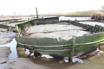 An old metal boat in the sand
