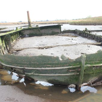 An old metal boat in the sand