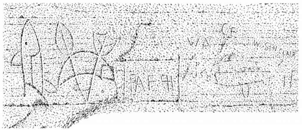 Carvings of a fish and other symbols