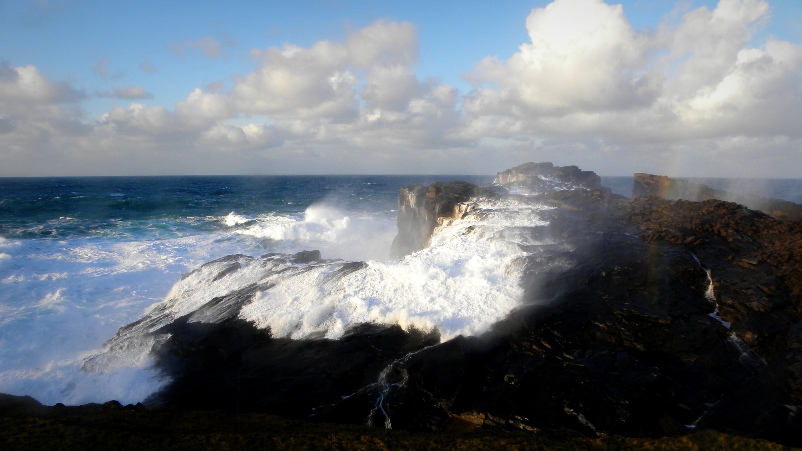 Waves crashing against rocks