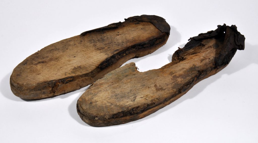 [IMAGE 11: These clogs were found on the ironworks site. They have a wooden sole with a leather upper.]