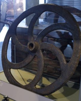 [IMAGE 9: This charging barrow wheel was found at Summerlee.]
