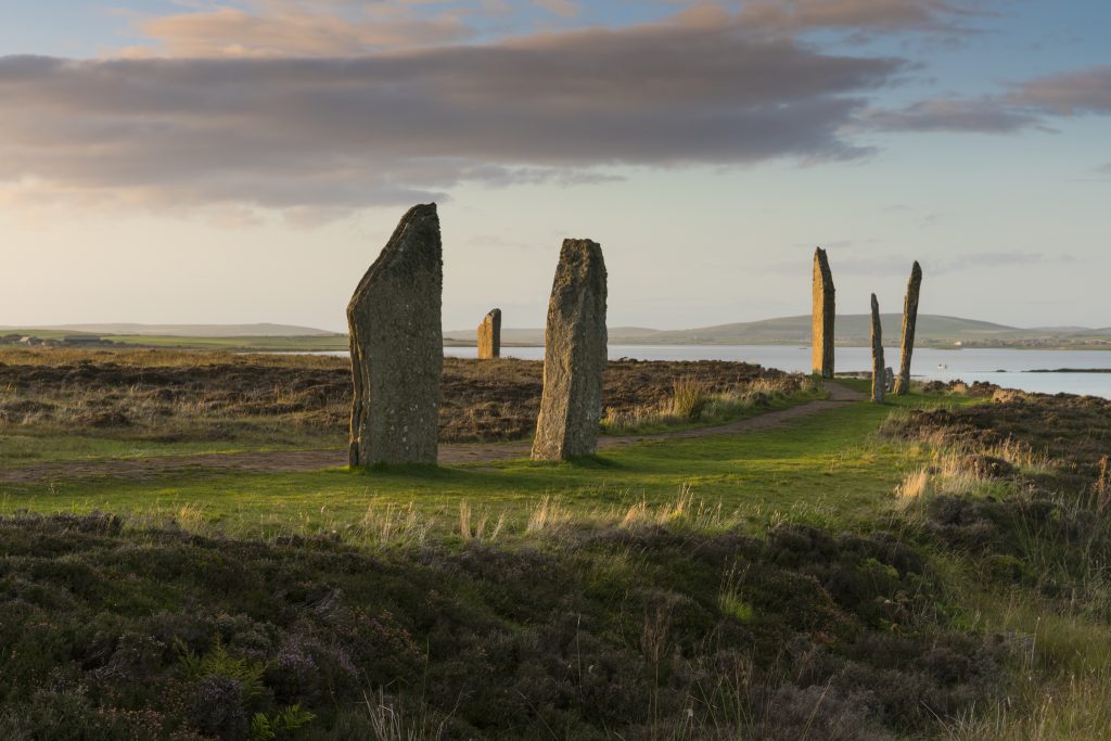 Photo of a standing stone circle by the sea.