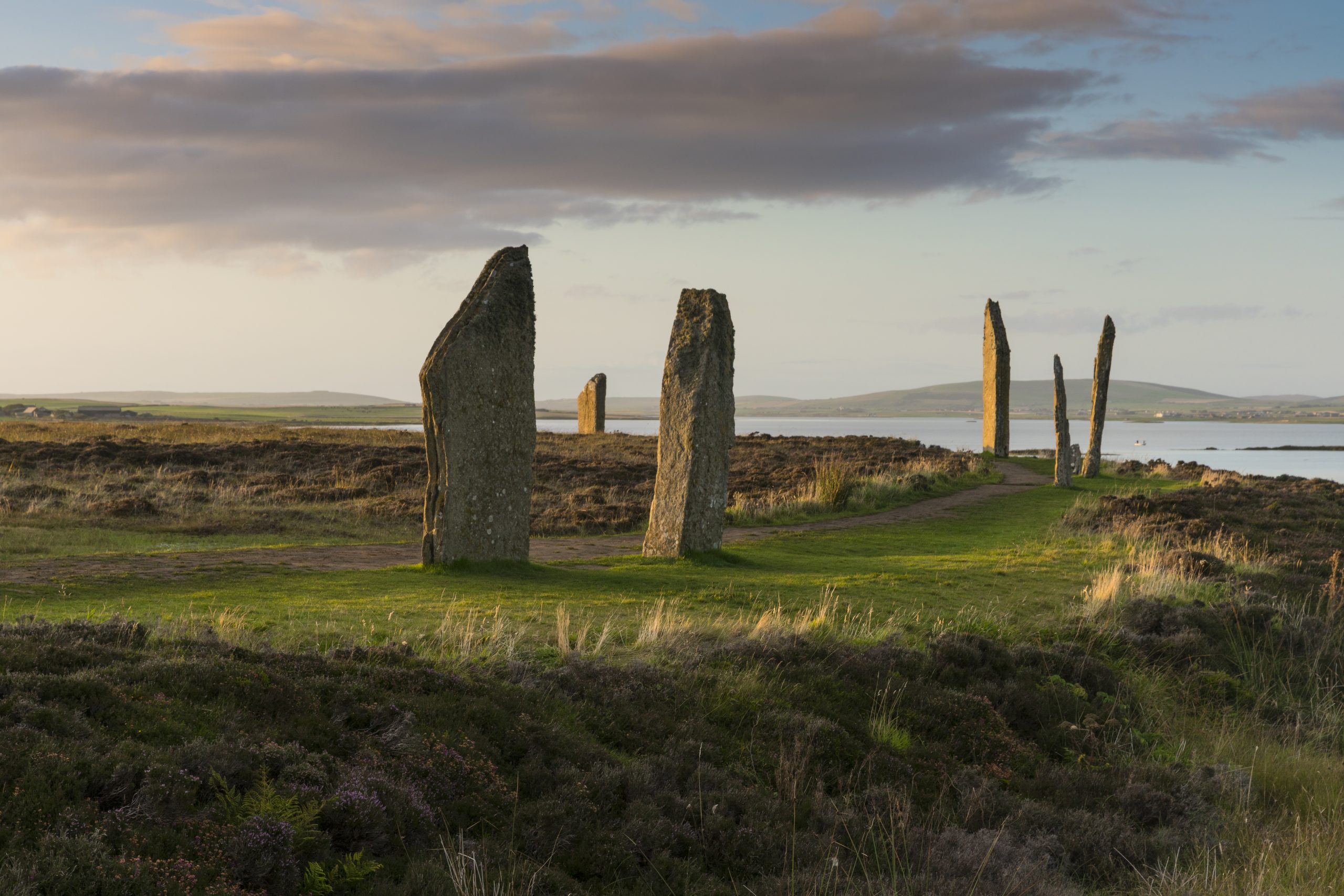 Photo of a standing stone circle by the sea.