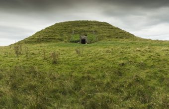 A grassy mound with an entrance