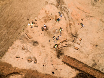 An aerial photograph of people working on an archaeological site