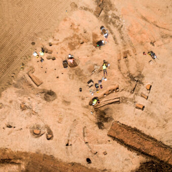 An aerial photograph of people working on an archaeological site