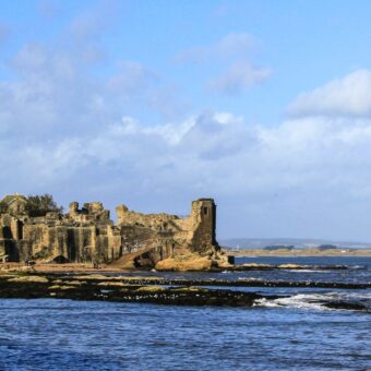 A ruined castle by the water