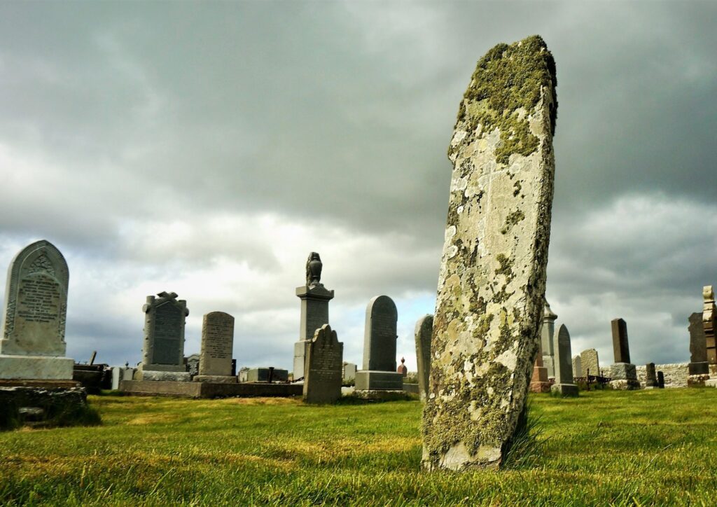 of Mid-Clyth standing stone / cemetery above by David Scott