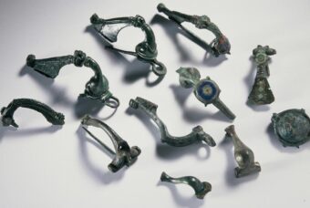 Eleven bronze brooches of varying size