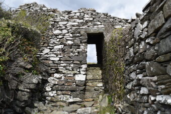 Photo of a ruined, grey stone castle