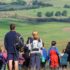 People in hiking clothes on a hill