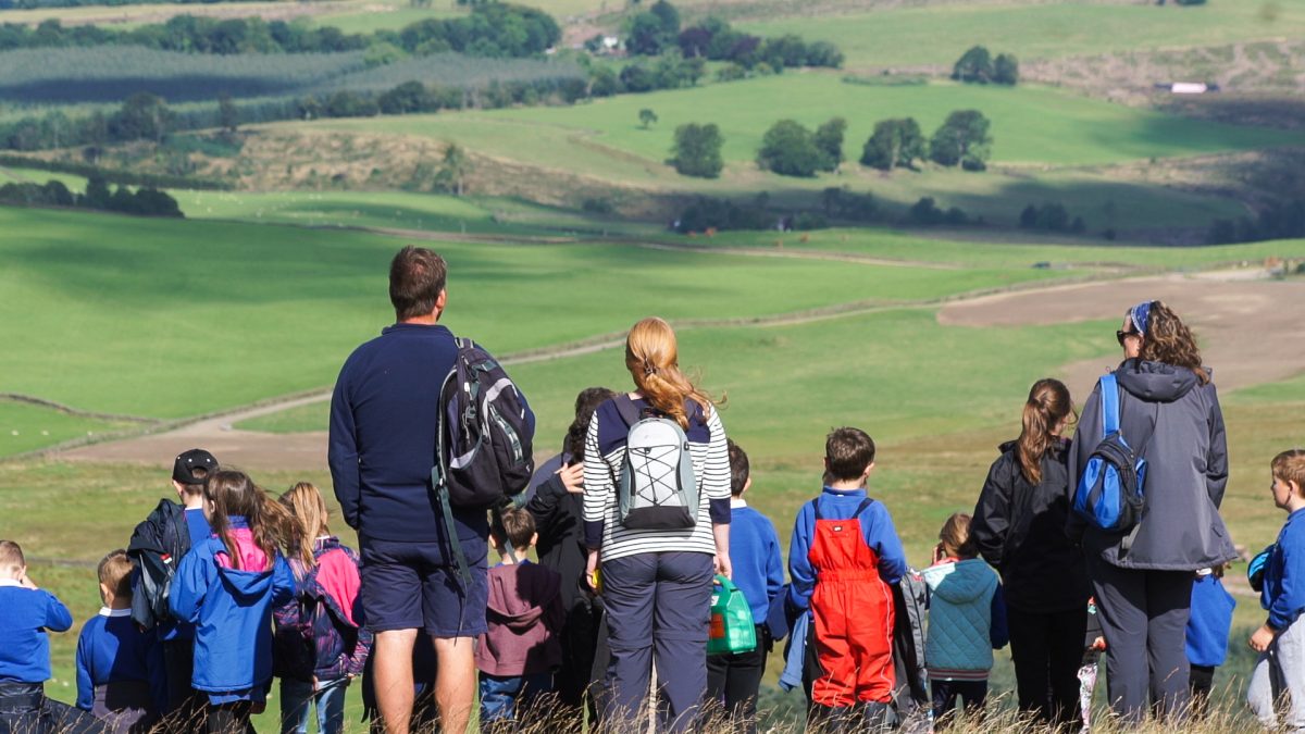 People in hiking clothes on a hill