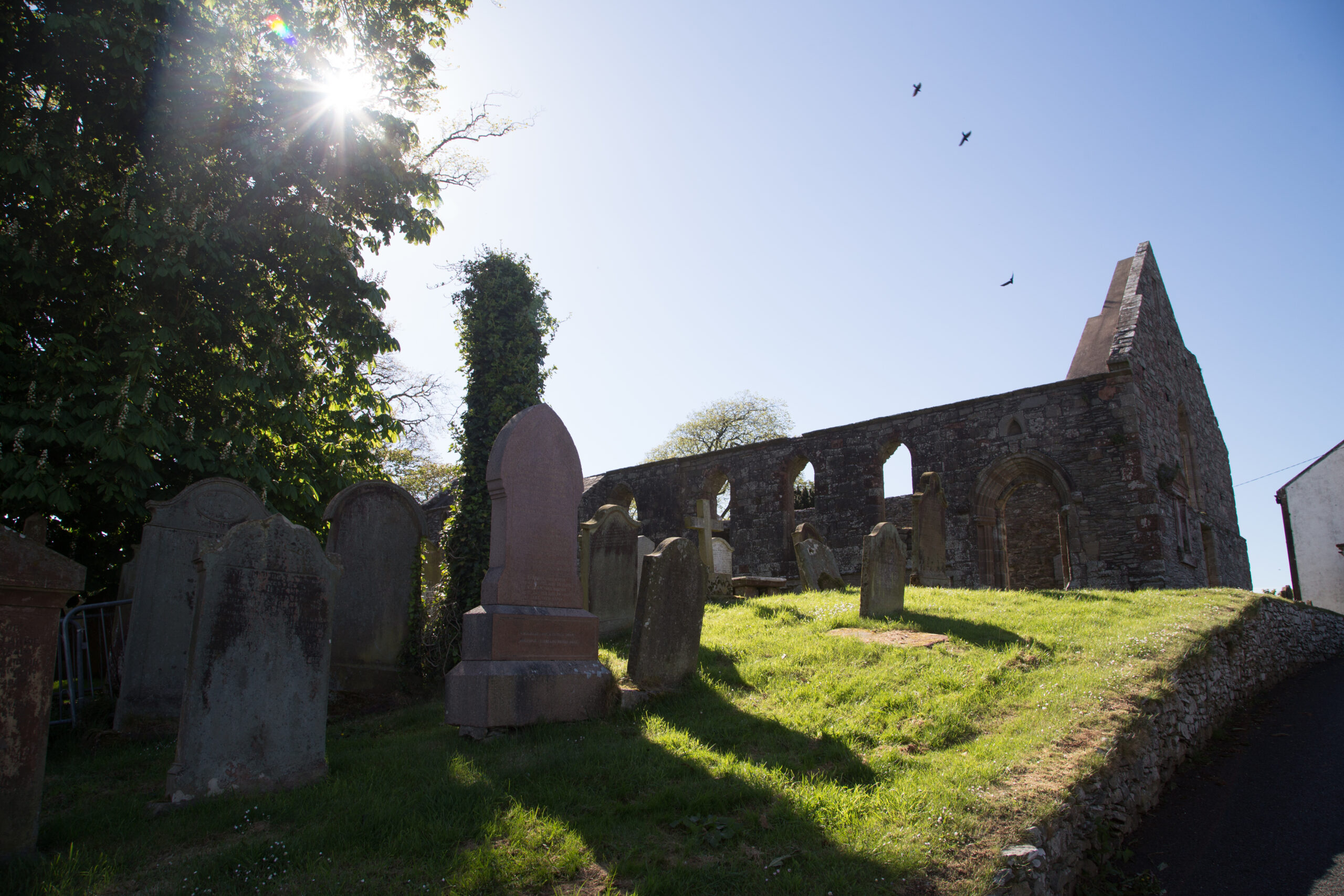 Photo of a ruined stone chapel in the sun