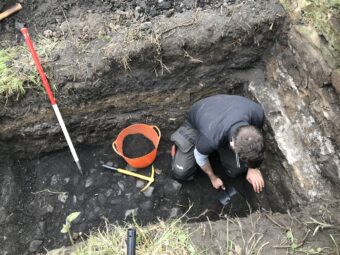 Person in a deep ditch