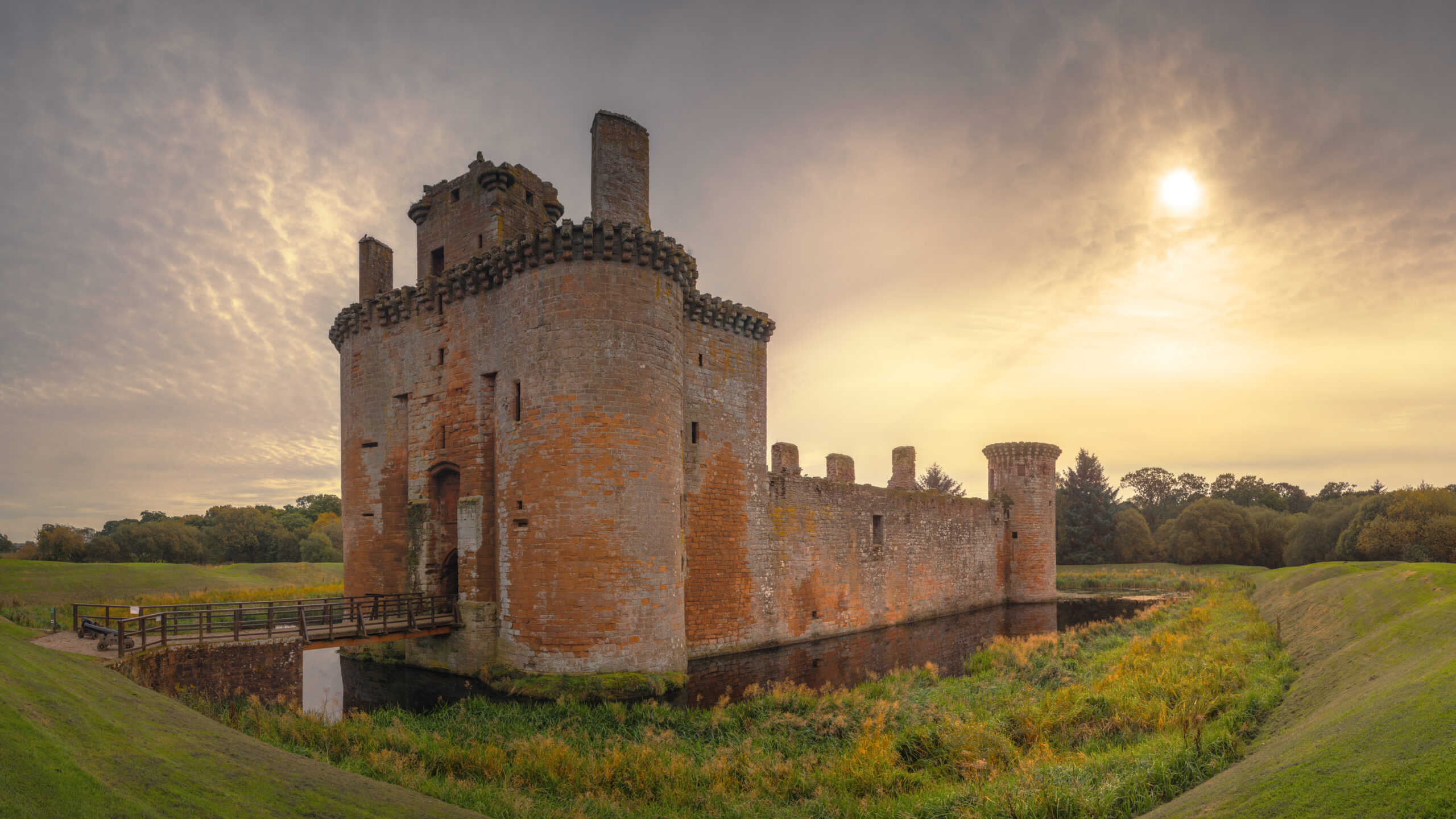 Photo of a stone built castle in a moat