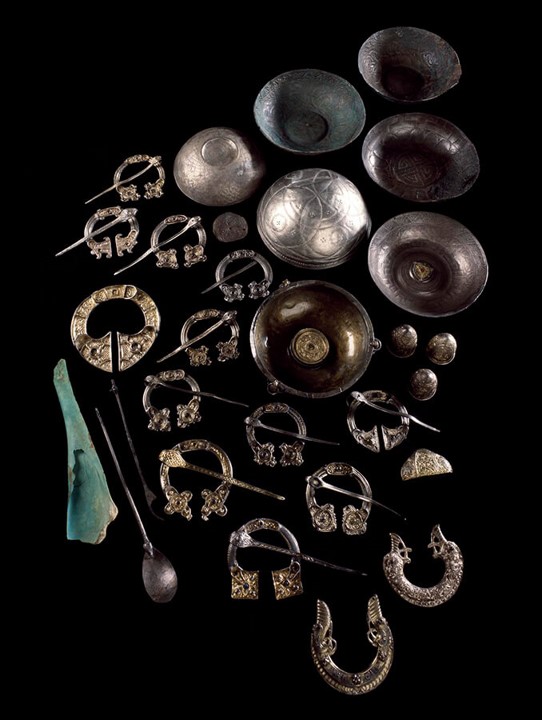 Photo of a group of silver and bone items from an archaeological hoard