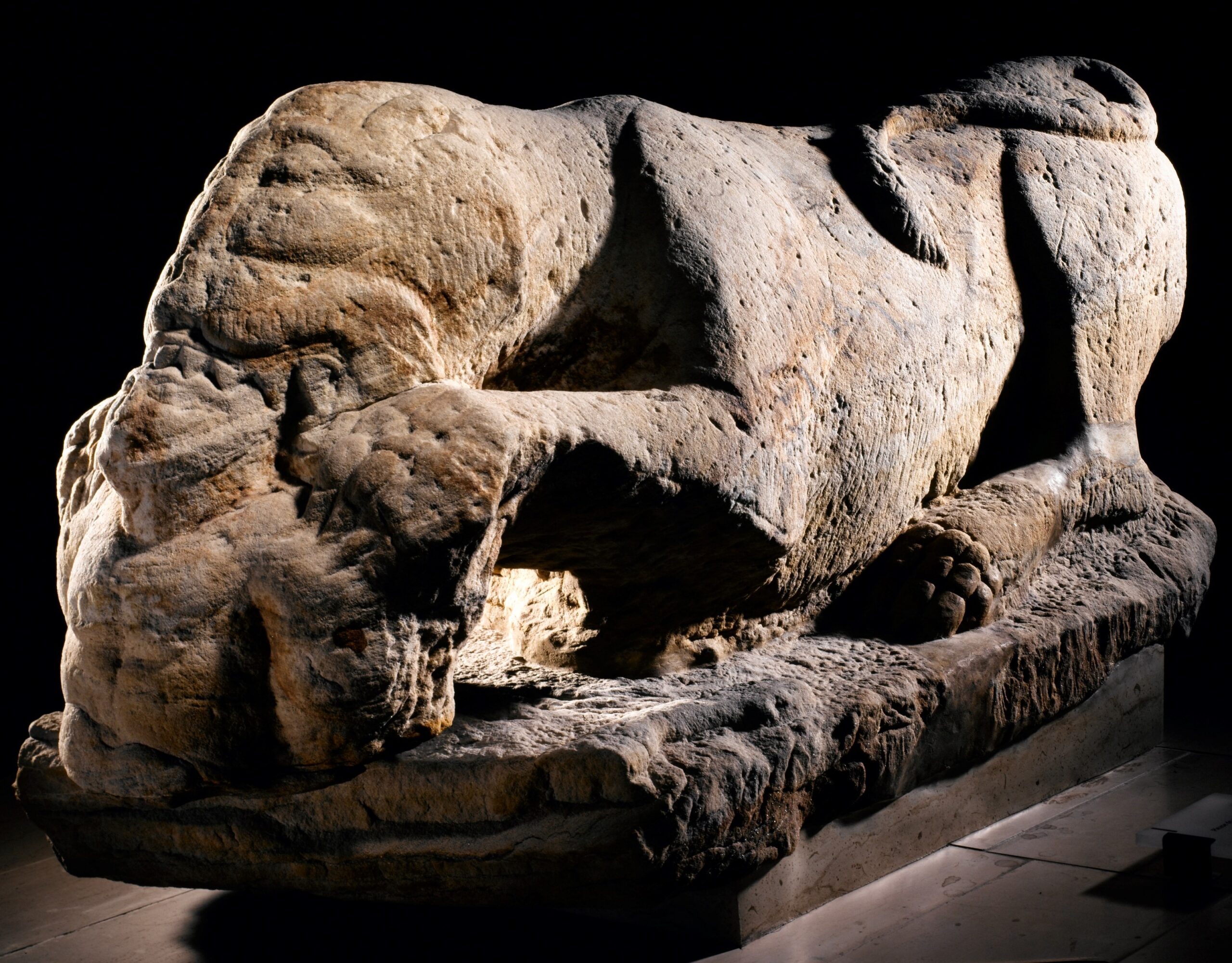 Photo of a lioness sculpture eating a human captive