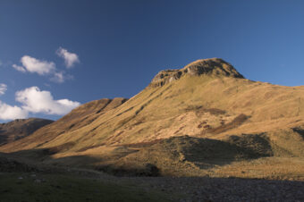 Photo of a hill at sunrise