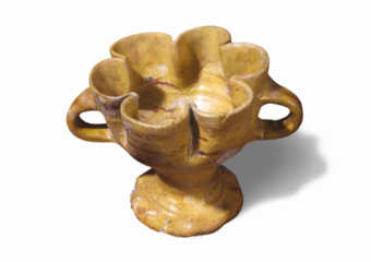 Photo of a yellow, lobed ceramic cup