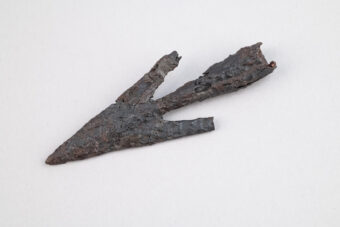 Photo of a barbed iron arrowhead