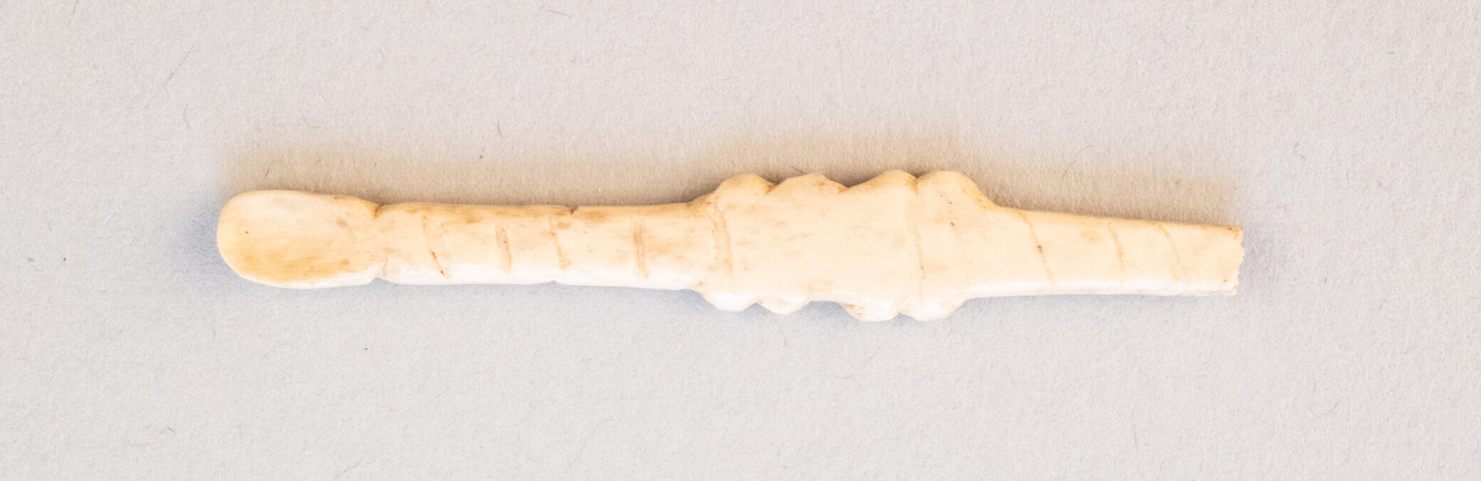 Photo of a tiny bone ear scoop