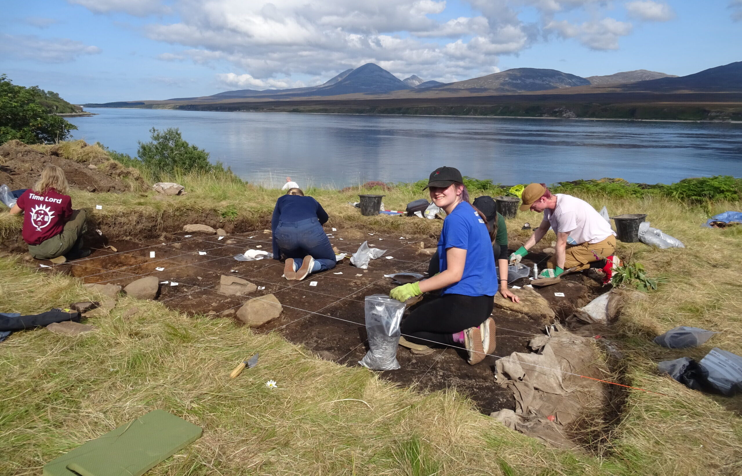 People at a dig by the water
