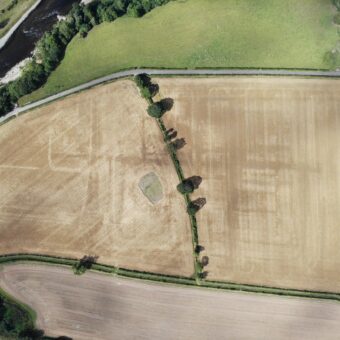 Aerial photo of fields featuring the remains of a Roman fort