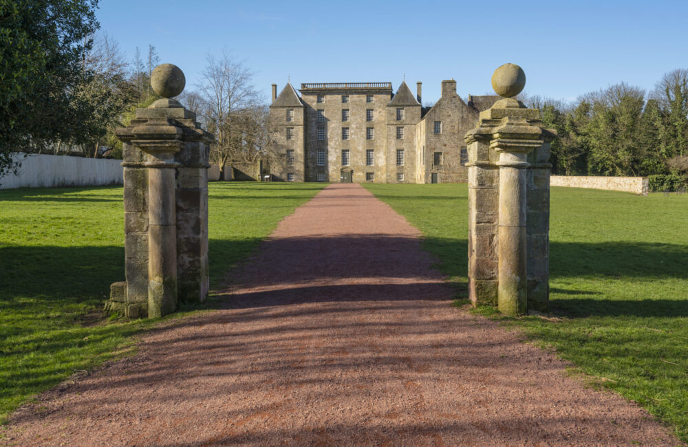 Large historic mansion with path leading up to it