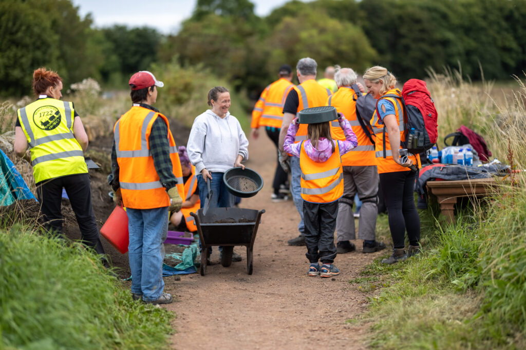People laughing at a dig
