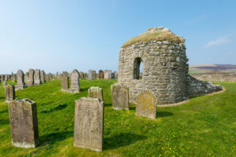 Photo of the remains of a small, stone round church
