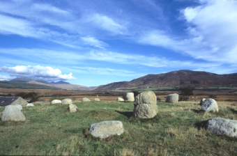 Photo of a short stone circle in a mountainous region