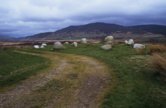 Photo of a short stone circle with a worn path winding through it