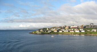 Photo of a Shetland island promontory leading into the ocean
