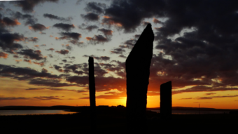 Three standing stones at sunset