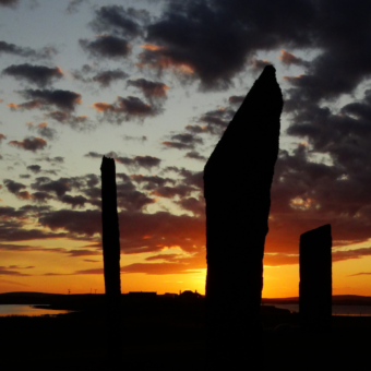 Three standing stones at sunset