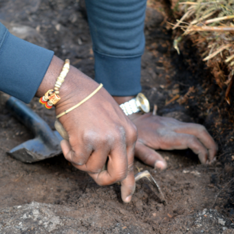 Person digging in a trench