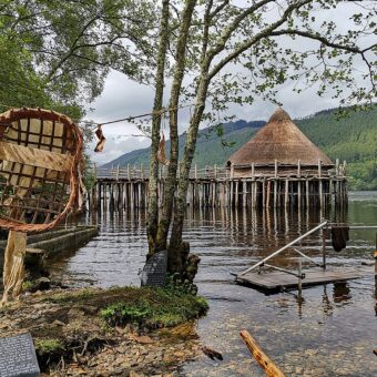 Wooden structure on water surrounded by various tools